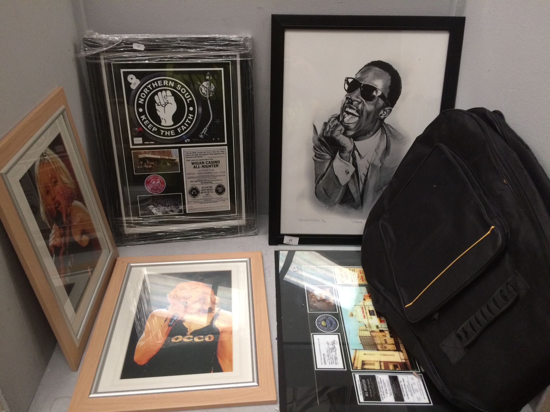 Guitar bag and 5 x framed prints of music artists