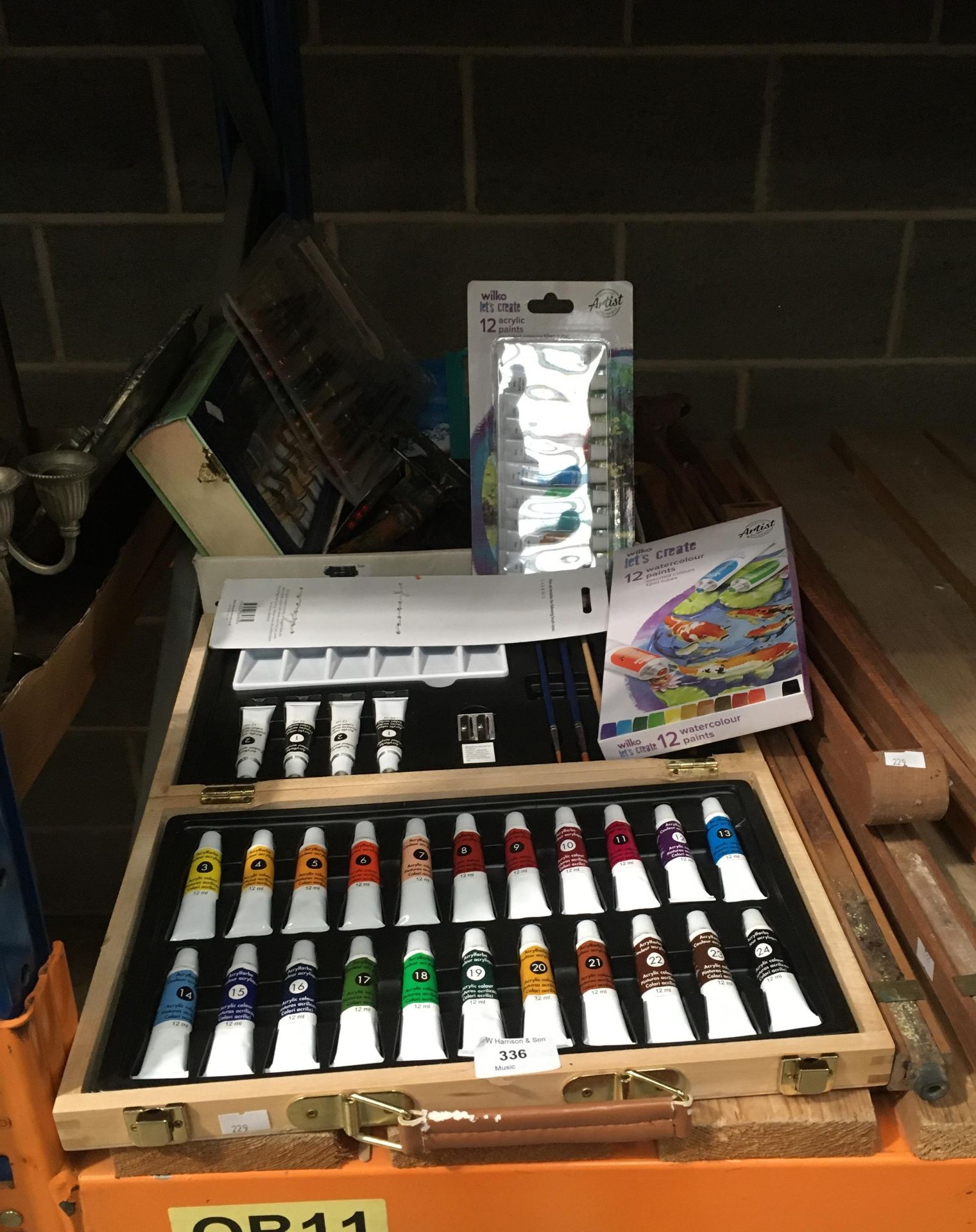 Assorted arts and crafts items, packs of water colour paints, acrylic paints, easel,