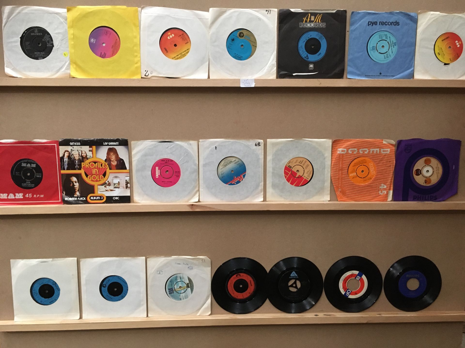 Contents to box a collection of approximately 140 45rpm singles - wide range of genres - football