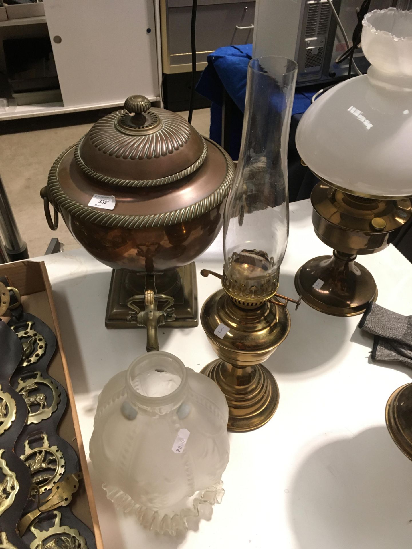 Traditional copper water/panjabi dispenser and a brass oil lamp