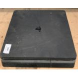 A Playstation 4 Pro Slimline gaming console S/N 0227452373-2057069 - no leads or adaptors (not