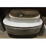 Wall hung vanity unit with glass top and a Sideal sink,
