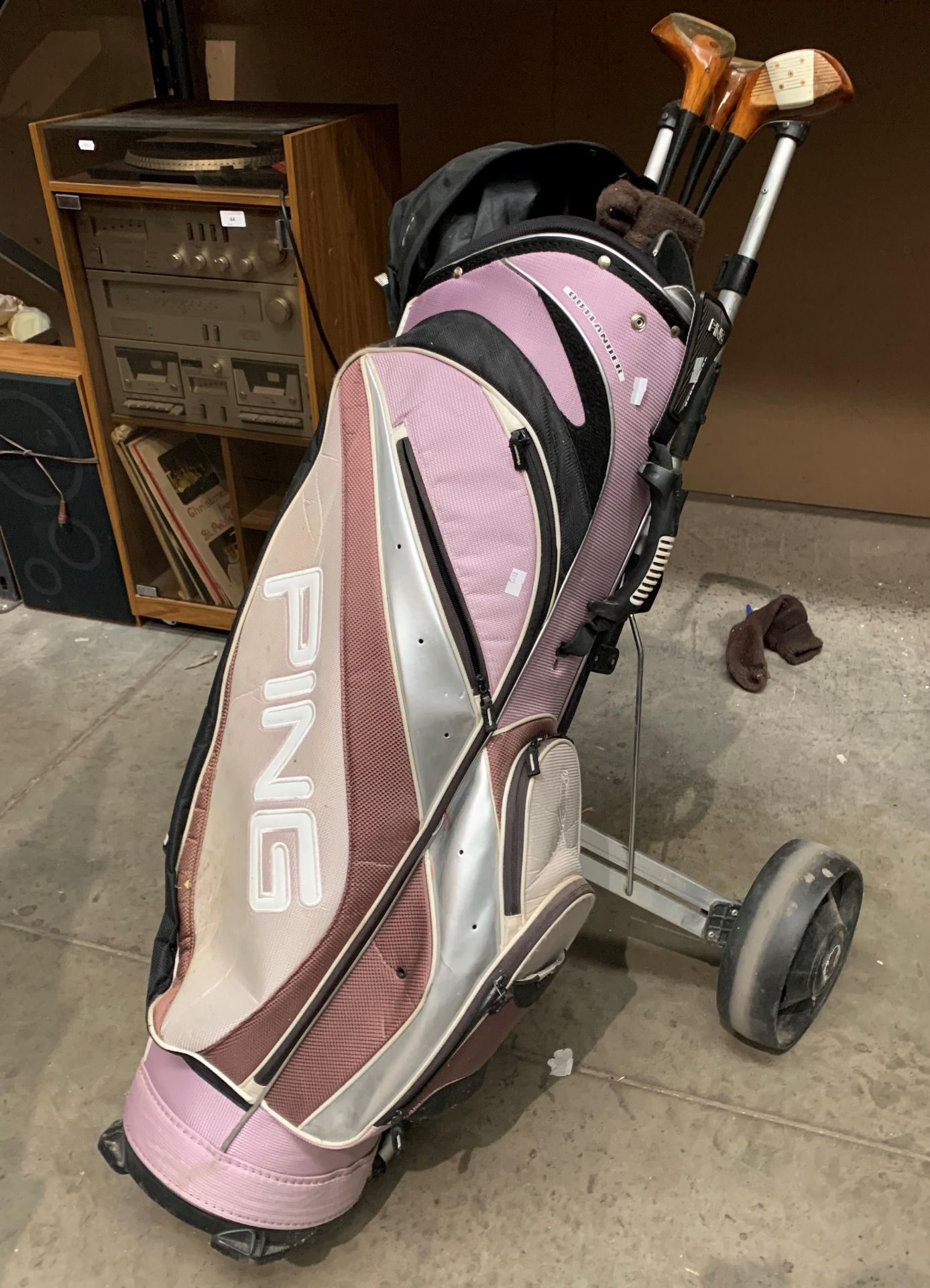 A Powa Kaddy twin PAC3 golf trolley, a Ping Outlander bag and three Macgregor tourney woods (1, 2,