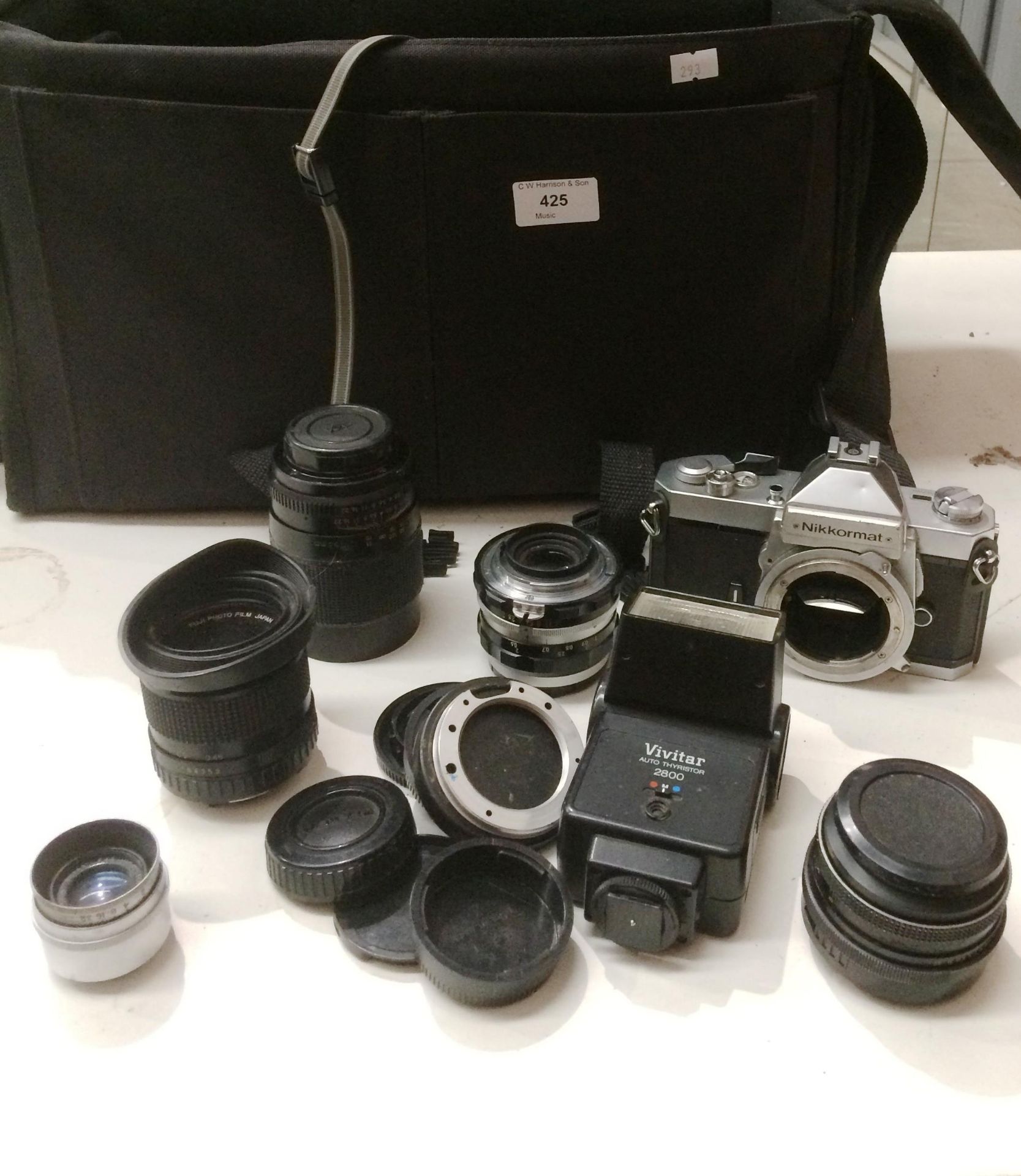 A camera bag and contents - Nikkormat camera body, a Vivitar Auto Thyristor,