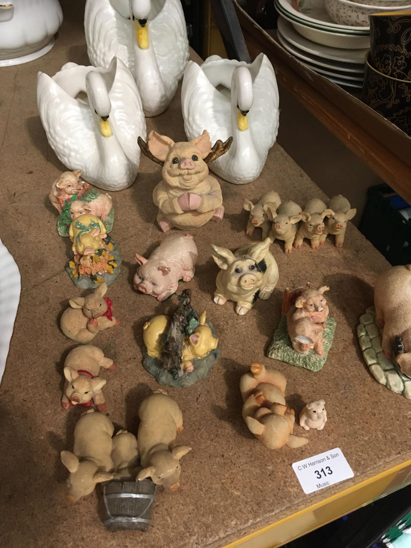 Fourteen assorted "Lazy Pigs" collection by Regency Fine Arts and three swan vases