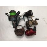 Five assorted fishing reels by Shakespeare,