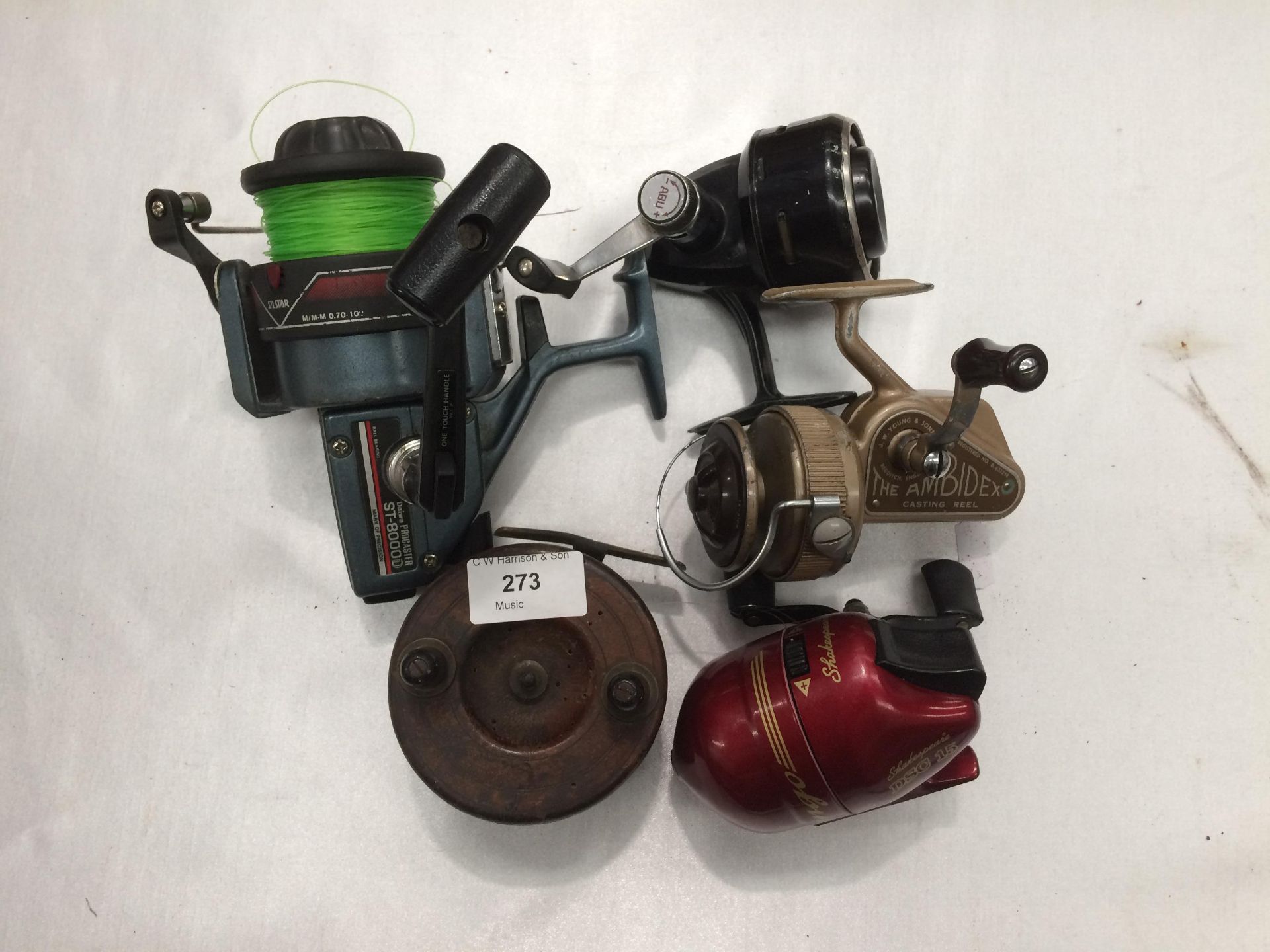 Five assorted fishing reels by Shakespeare,