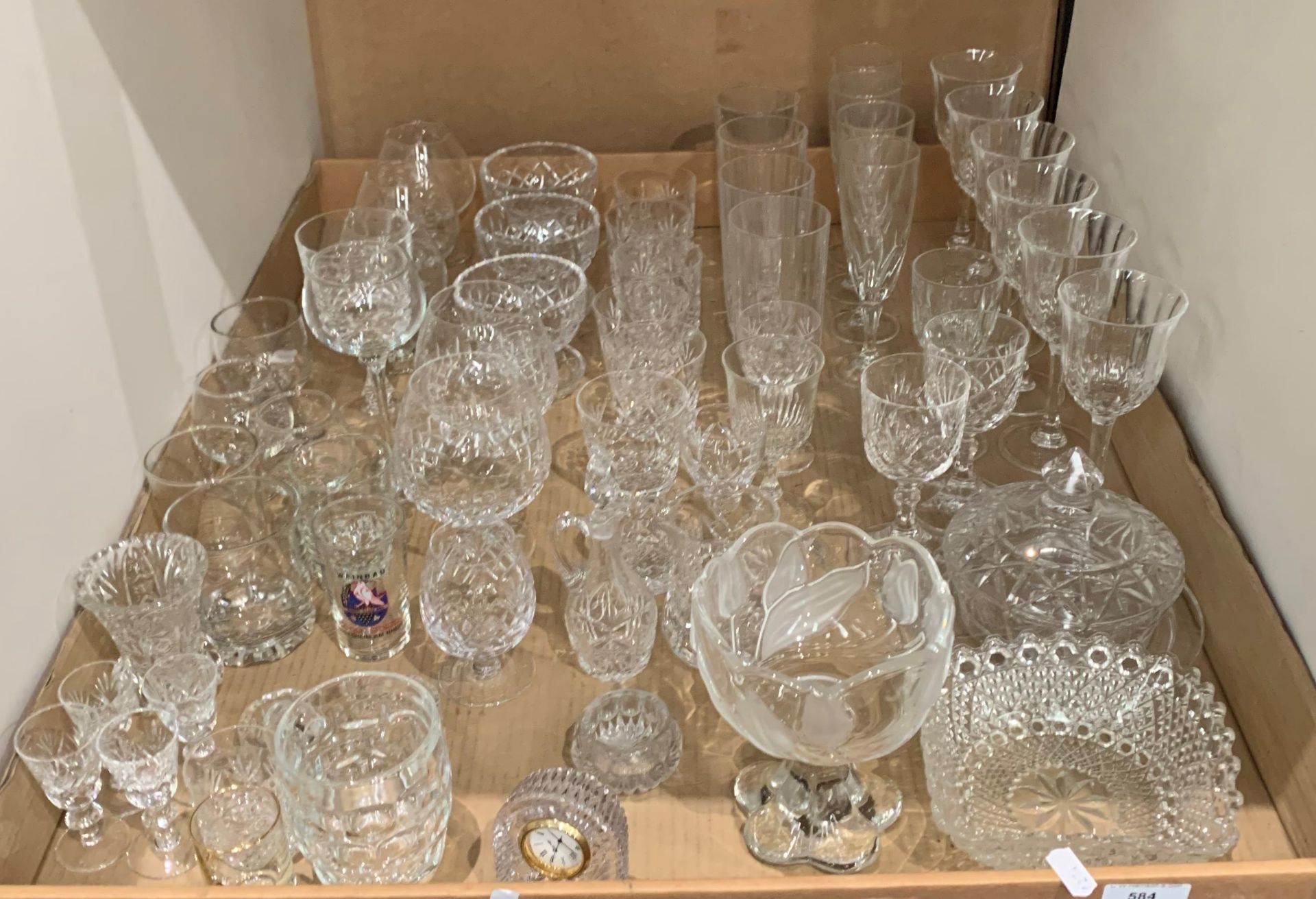 Contents to tray a collection of drinking glasses and other glassware