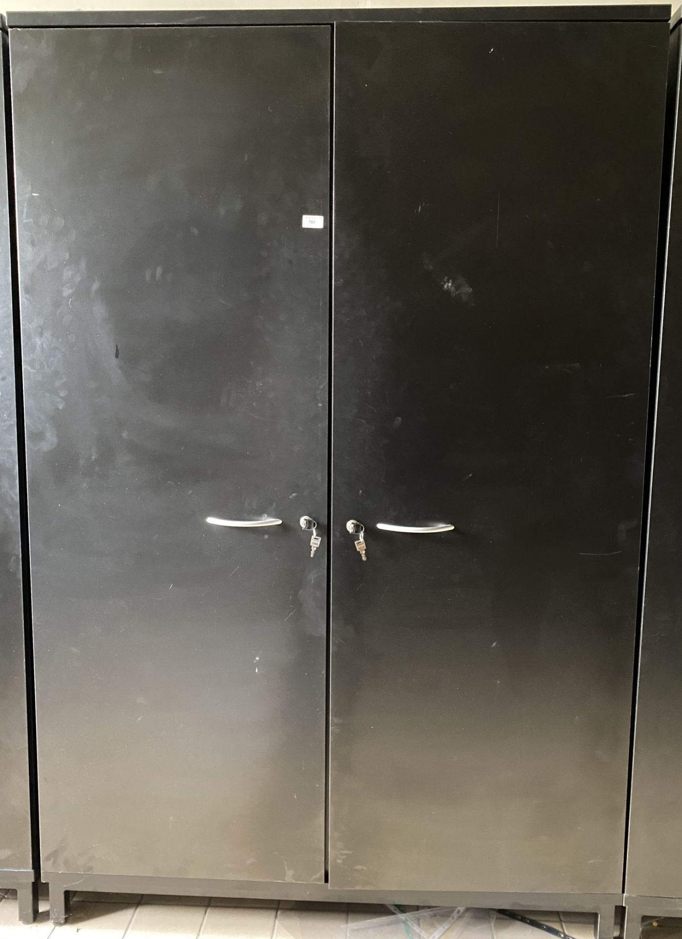 A black 2 door wooden stationary cabinet
