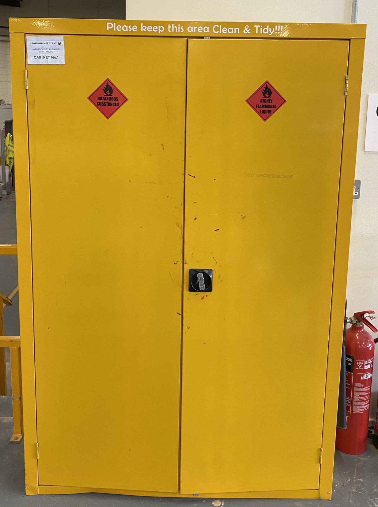 A 2 door yellow hazardous substances cab