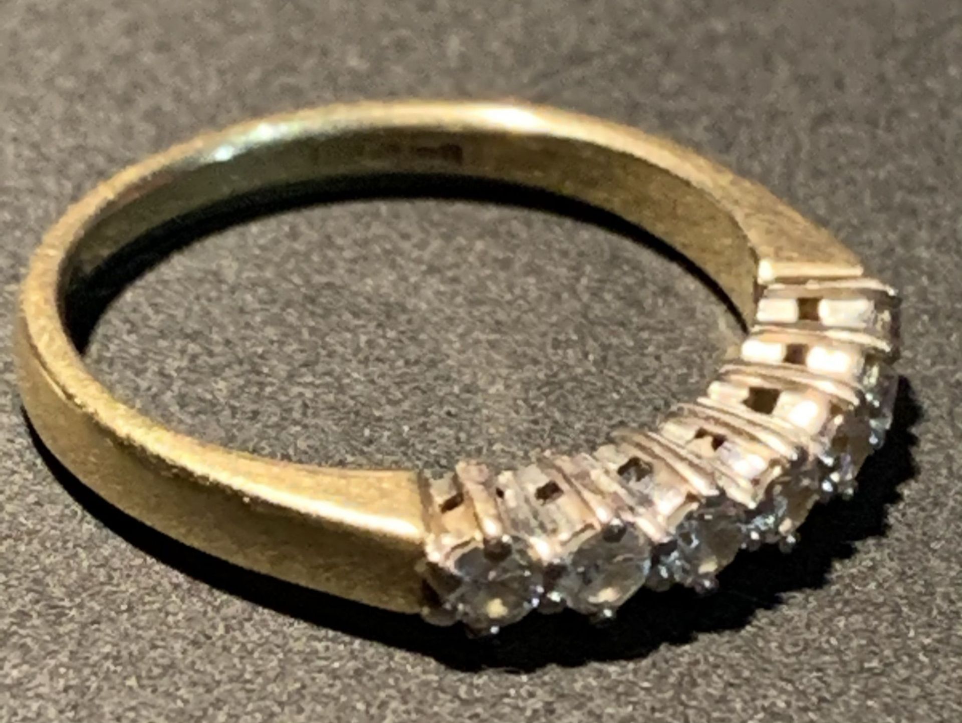 An 18ct gold half eternity ring, size K, set with seven diamonds, - Image 2 of 3