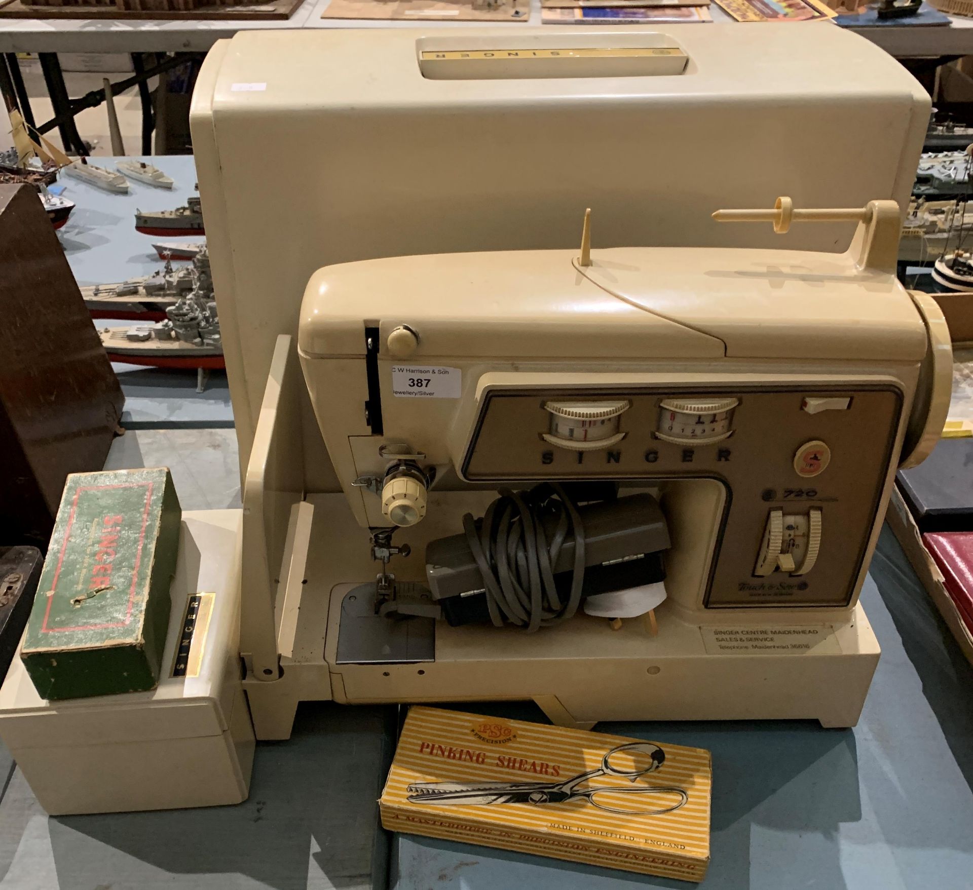 A Singer 720 portable sewing machine in case complete with foot pedal,