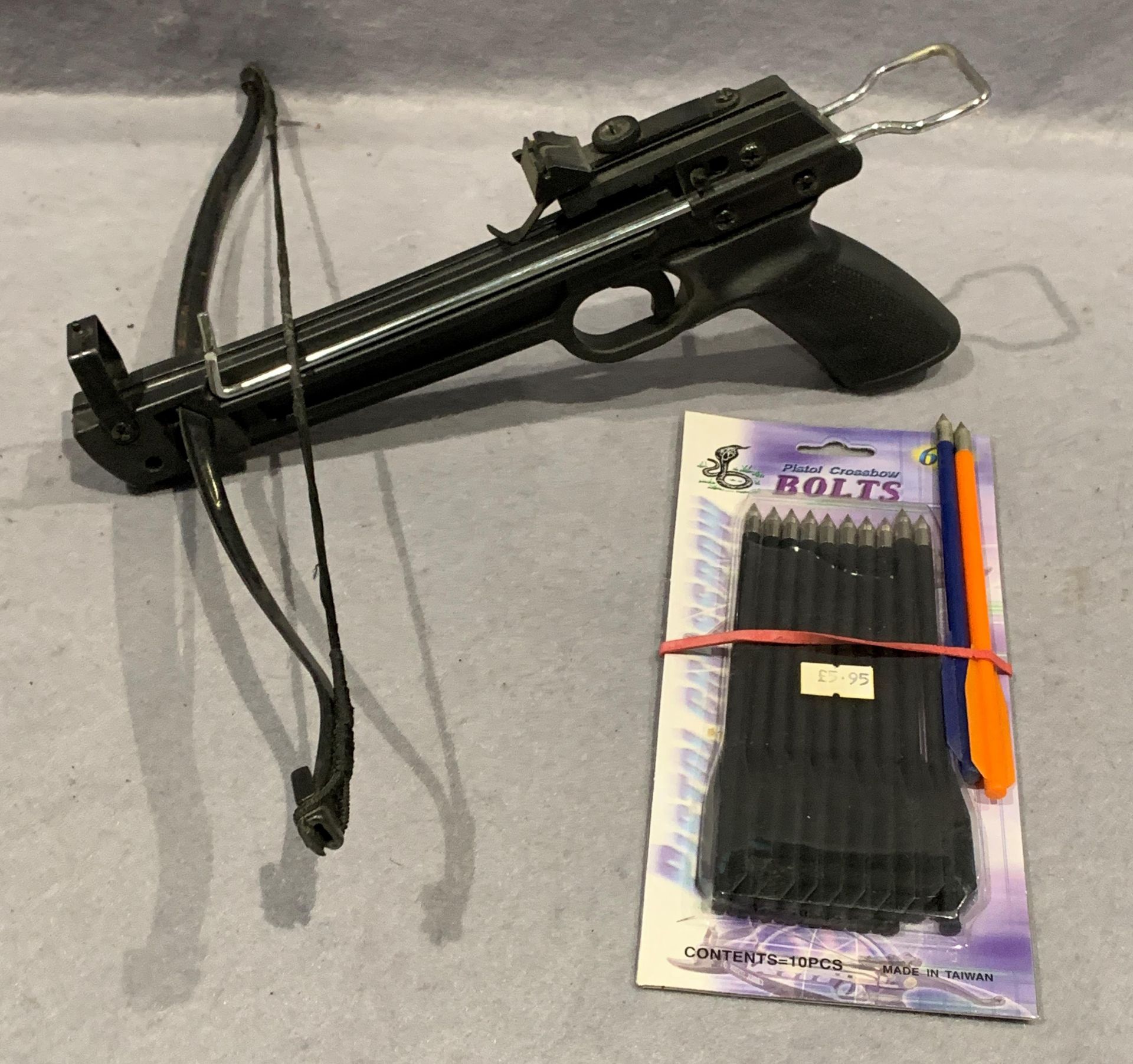 A hand held sport crossbow and a pack of 6" bolts [Please note: to bid on this lot you must be over