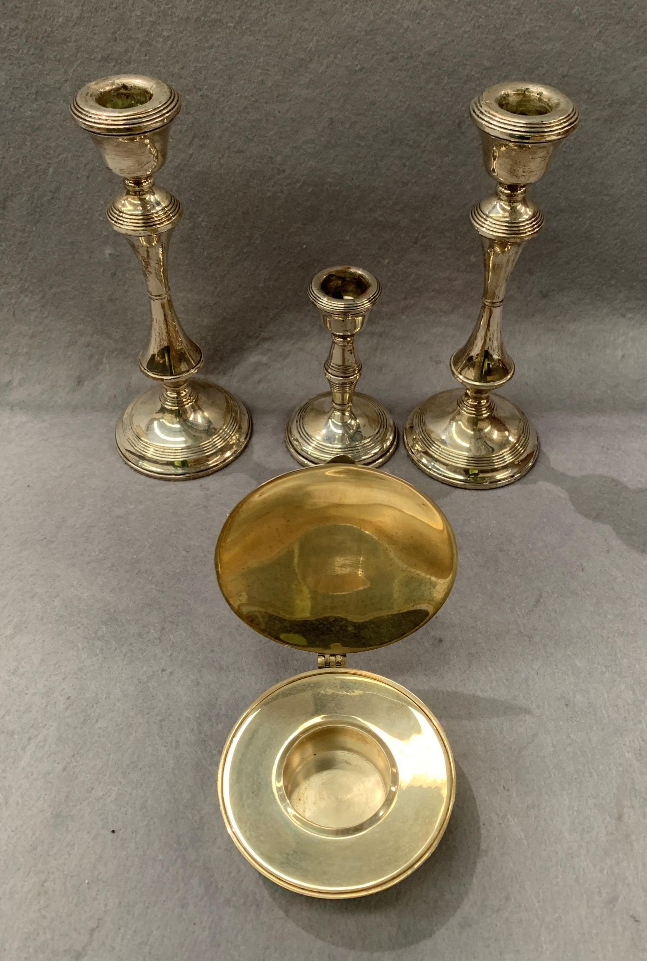 A pair of silver candlesticks, each 21cm high, a smaller silver candlestick, - Image 2 of 2