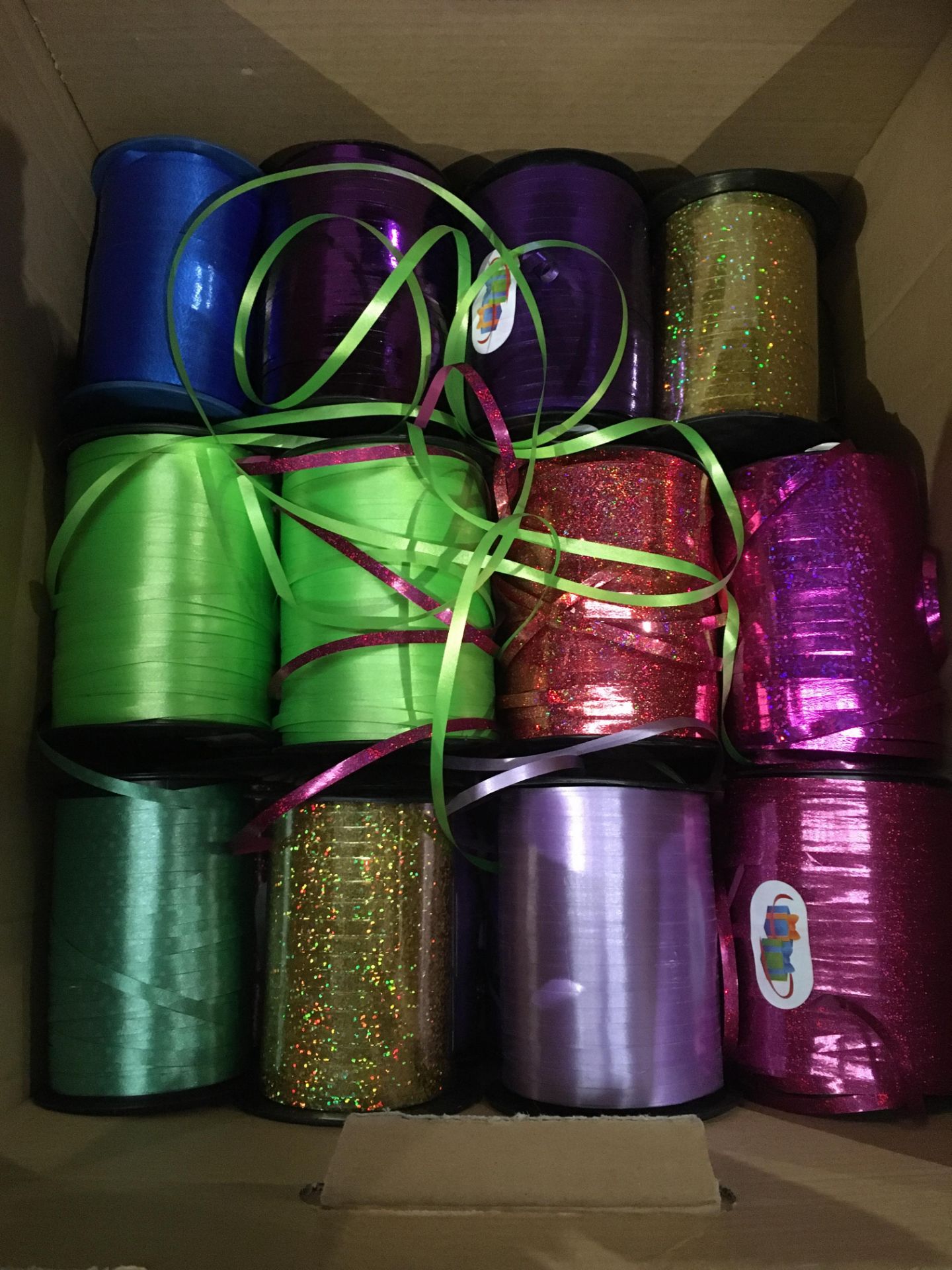 Twenty-four rolls of decorative ribbon