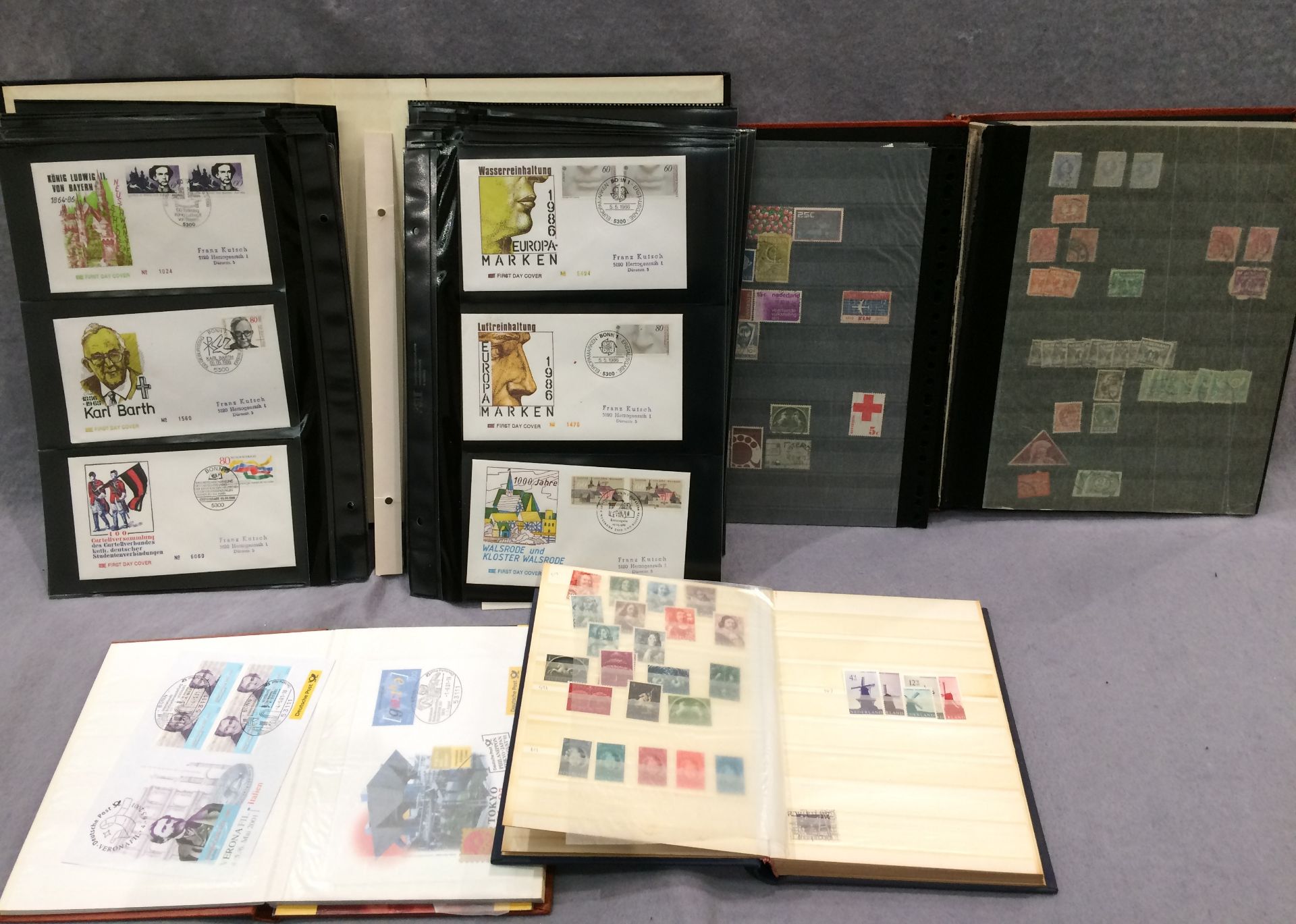 Four stamp albums - three Netherlands and one East German