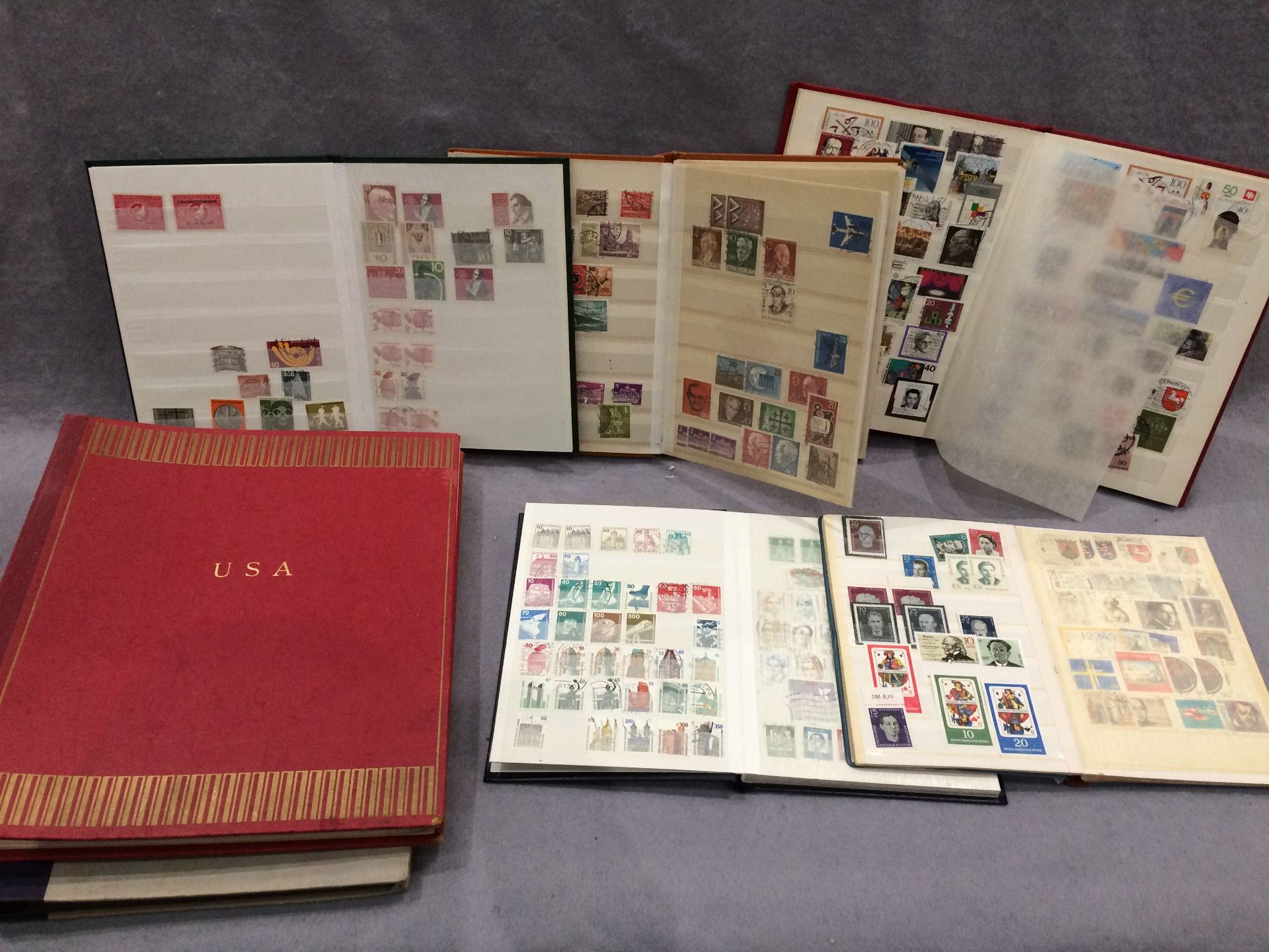 Seven stamp albums - fiver German and two USA