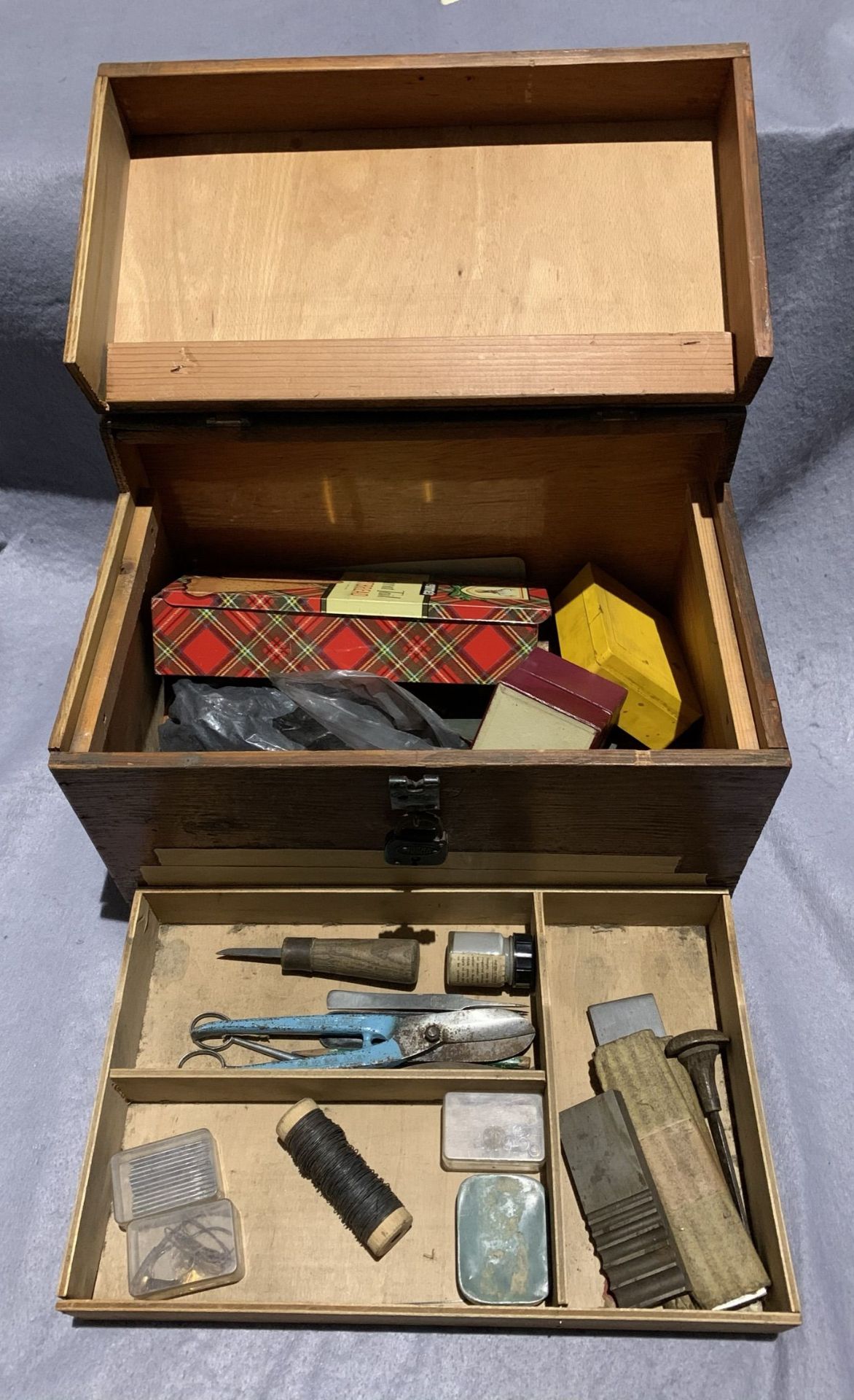 A jeweller's portable wooden workbox containing various tools and consumables and a small amount of