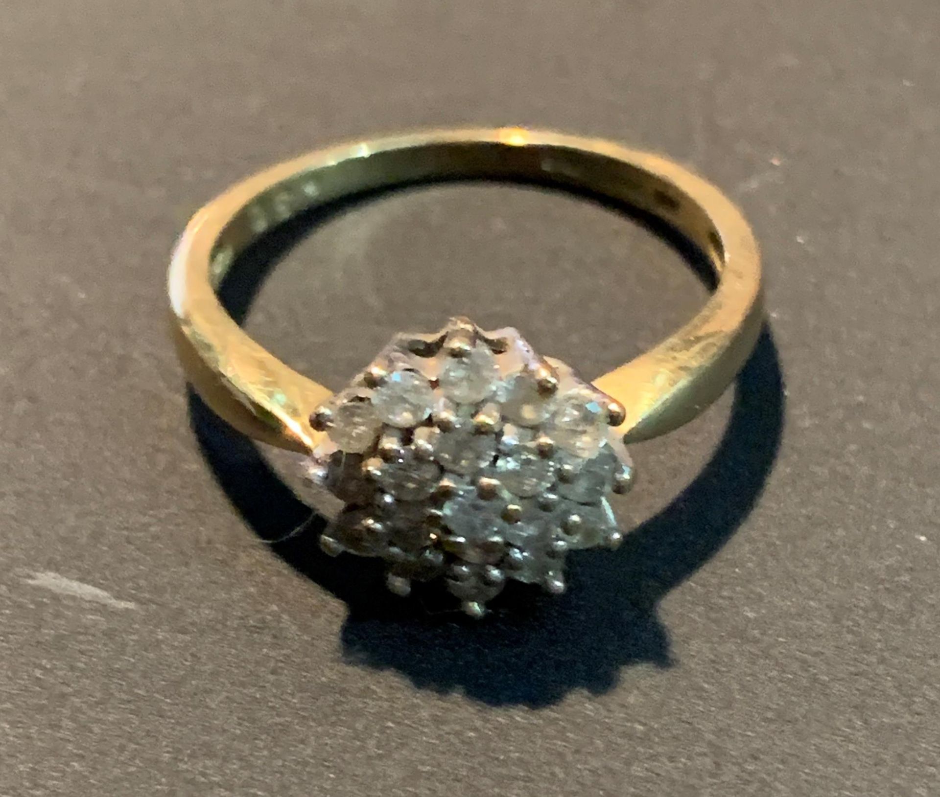 An 18ct gold diamond cluster ring, size O, total approximate weight 3.