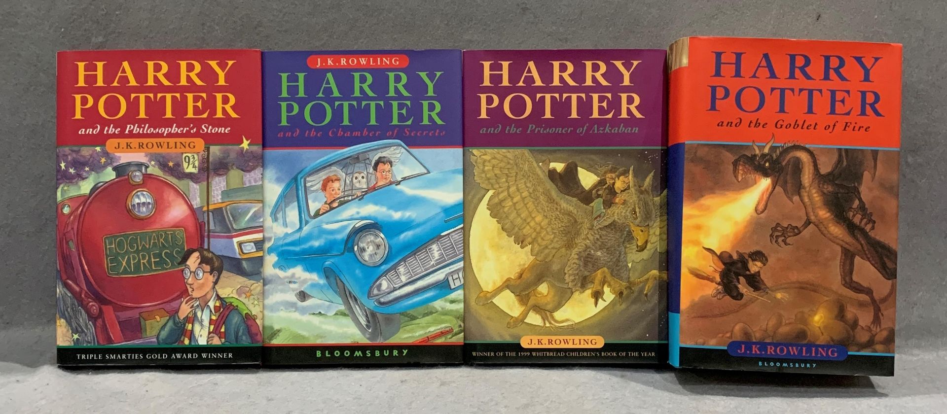J K Rowling, four Harry Potter hard back books, published by Bloomsbury - The Philosopher's Stone,