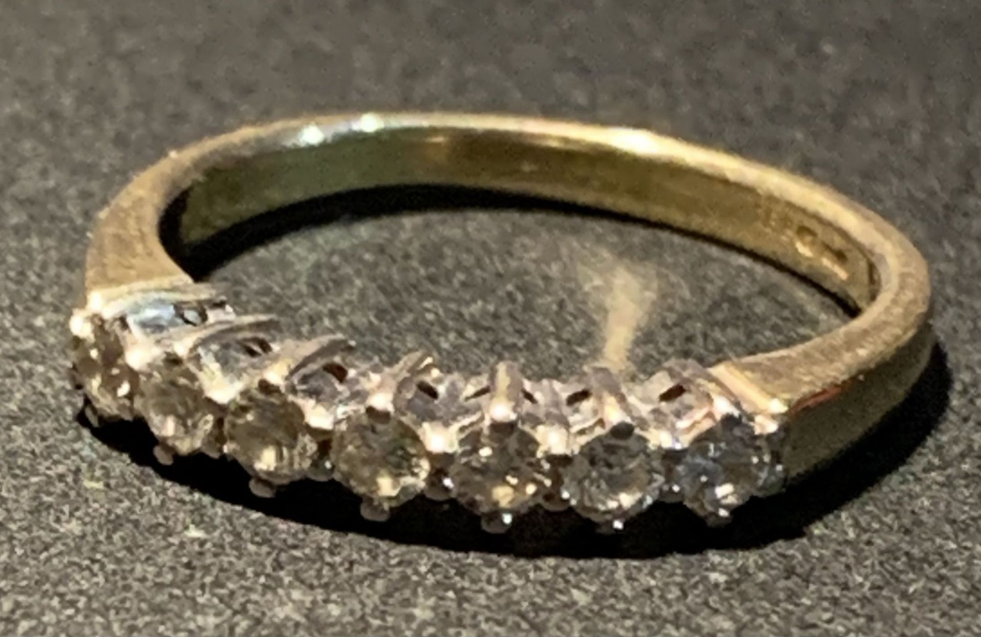An 18ct gold half eternity ring, size K, set with seven diamonds, - Image 3 of 3