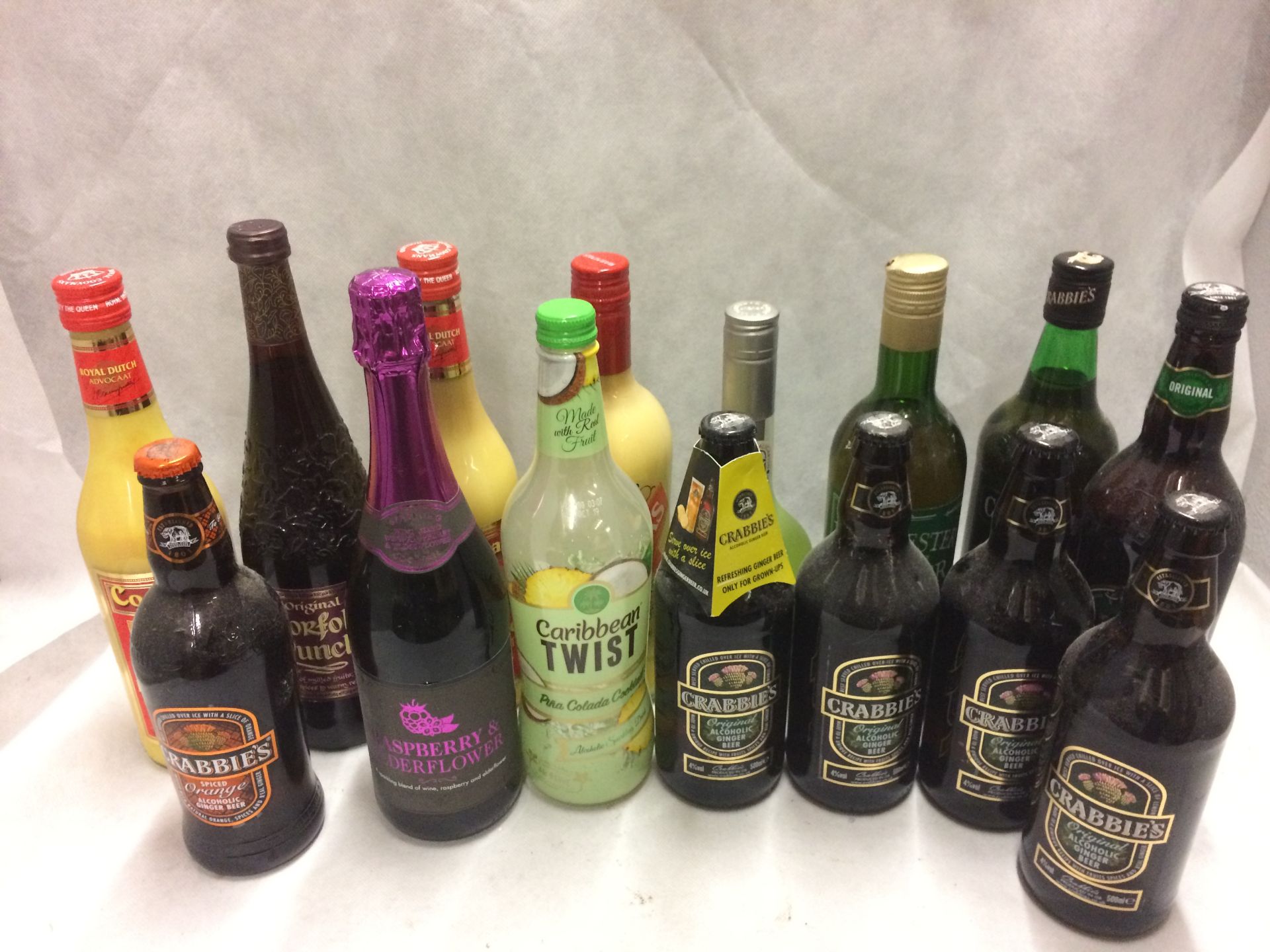 A collection of 15 x bottles of Advocaat, Crabbies Alcoholic ginger beer,