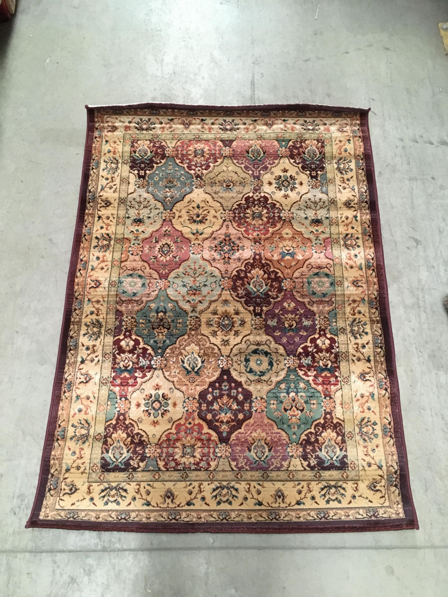 A Gabiro 208 red patterned rug - 120cm x