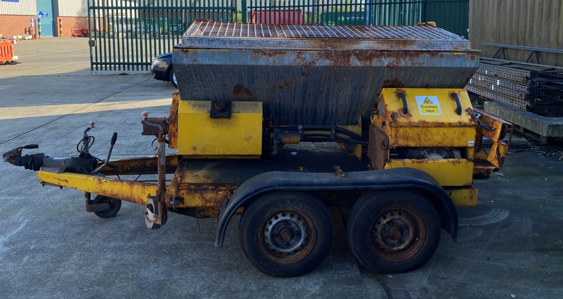 A DIESEL SALT SPREADER (1700kg capacity) mounted on a four wheel trailer Model TS1200 Serial number