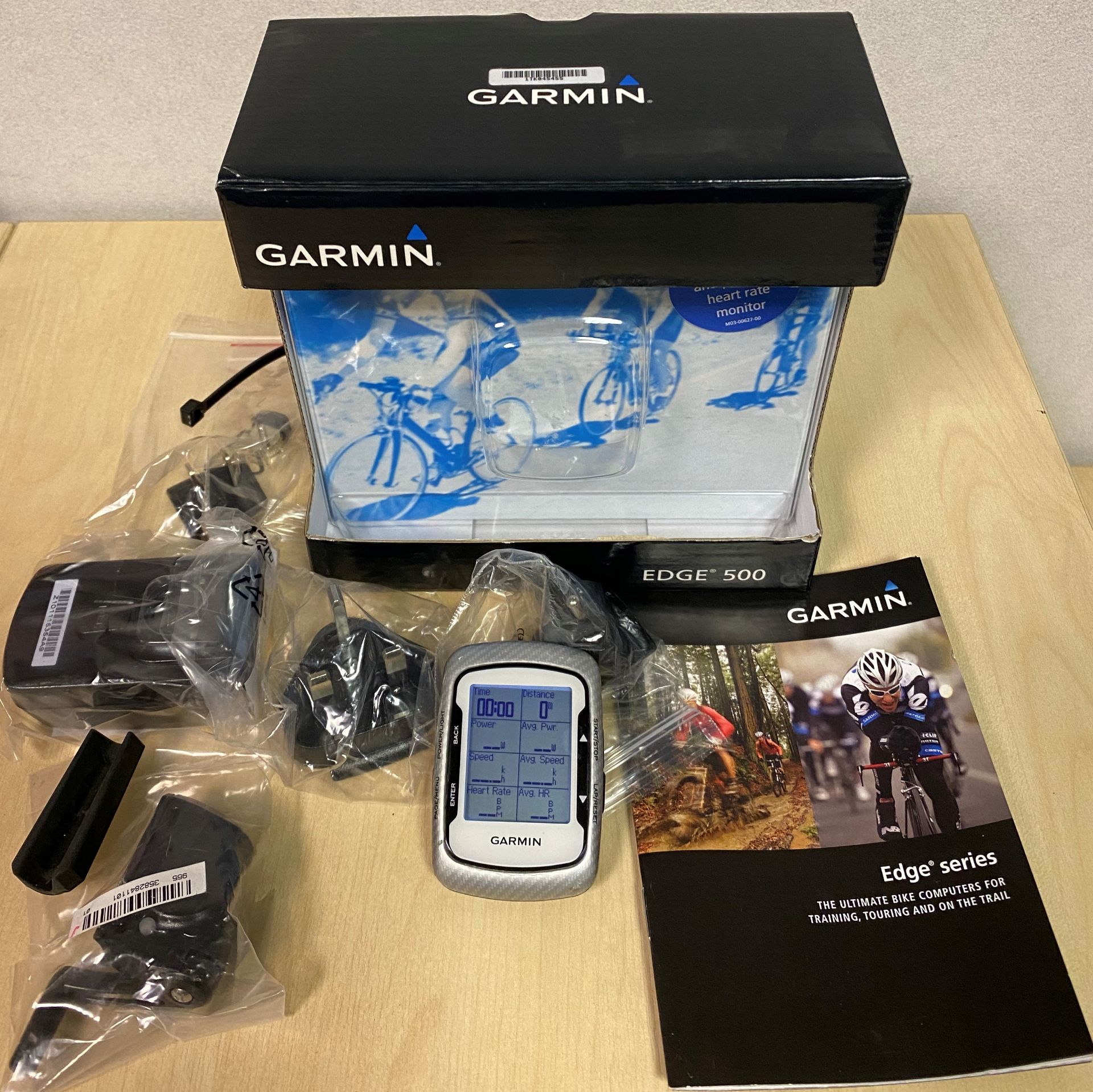 A Garmin Edge 500 cycling computer c/w heart rate monitor,