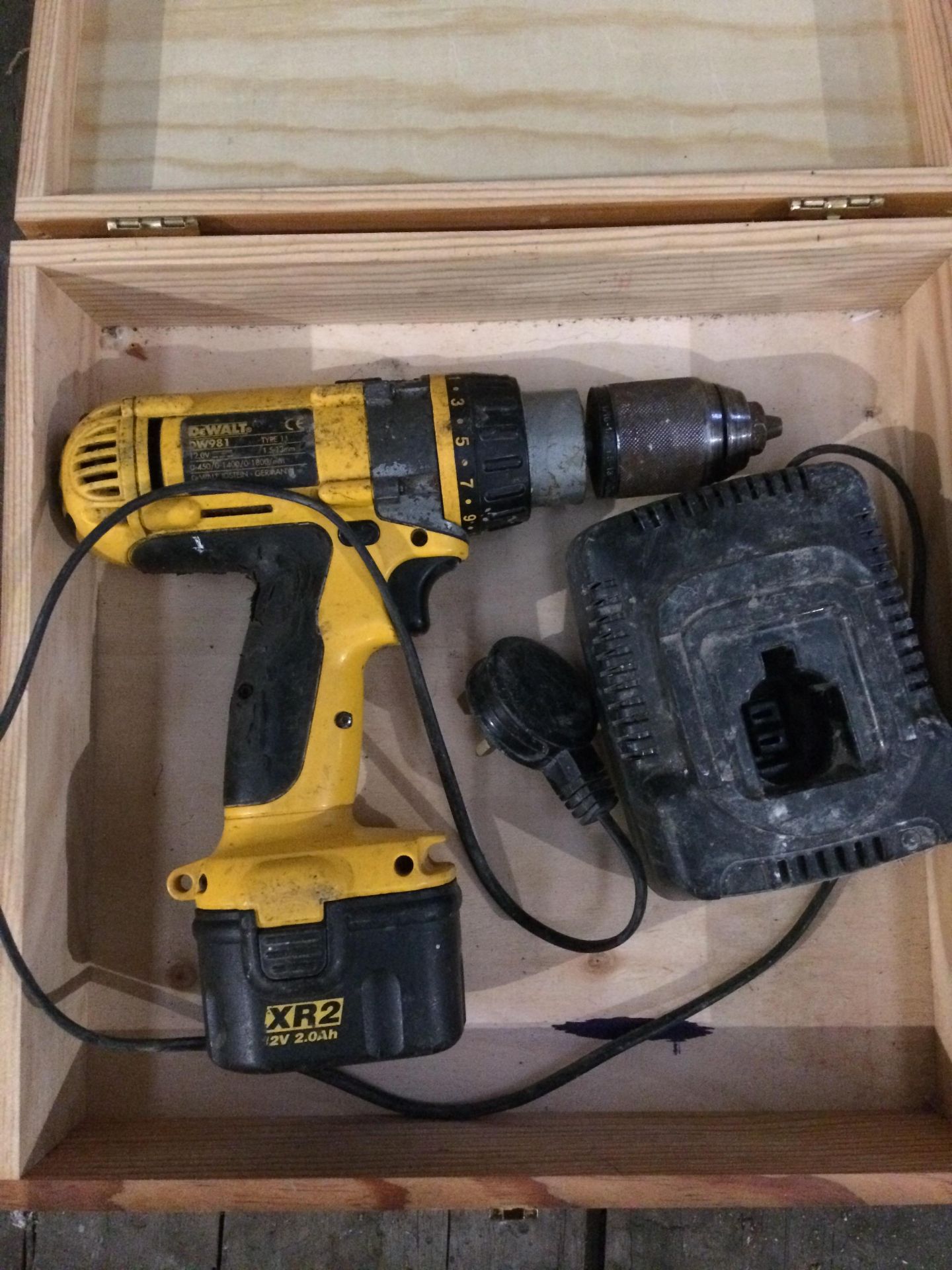 A DeWalt DW981 12v cordless drill complete with battery and charger in non-matching wood box