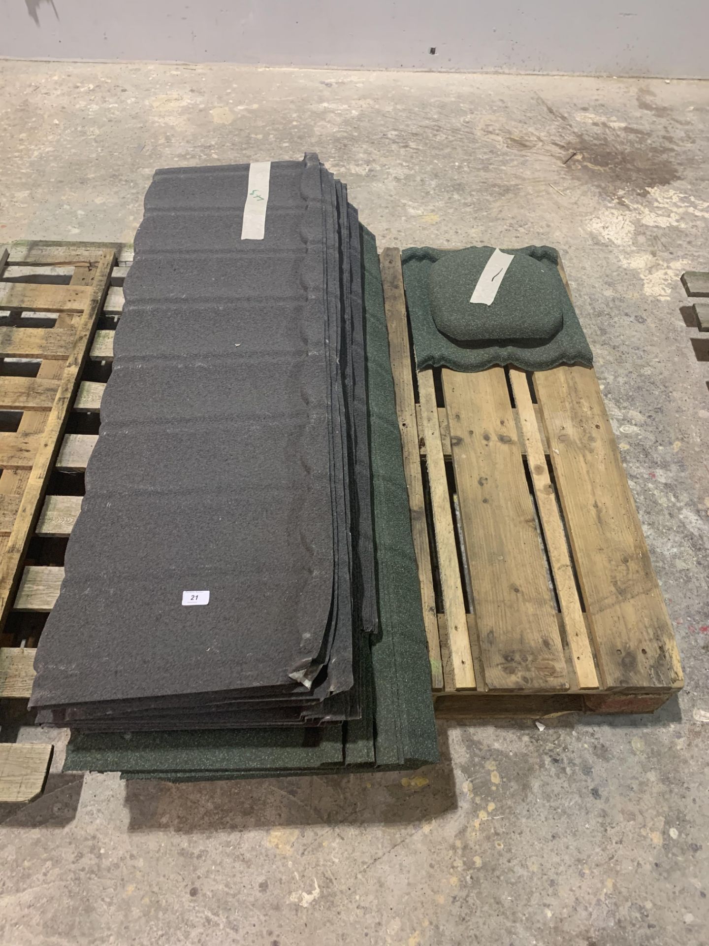 Pallet of approx 43 plastic textured roof tiles and 1 cap