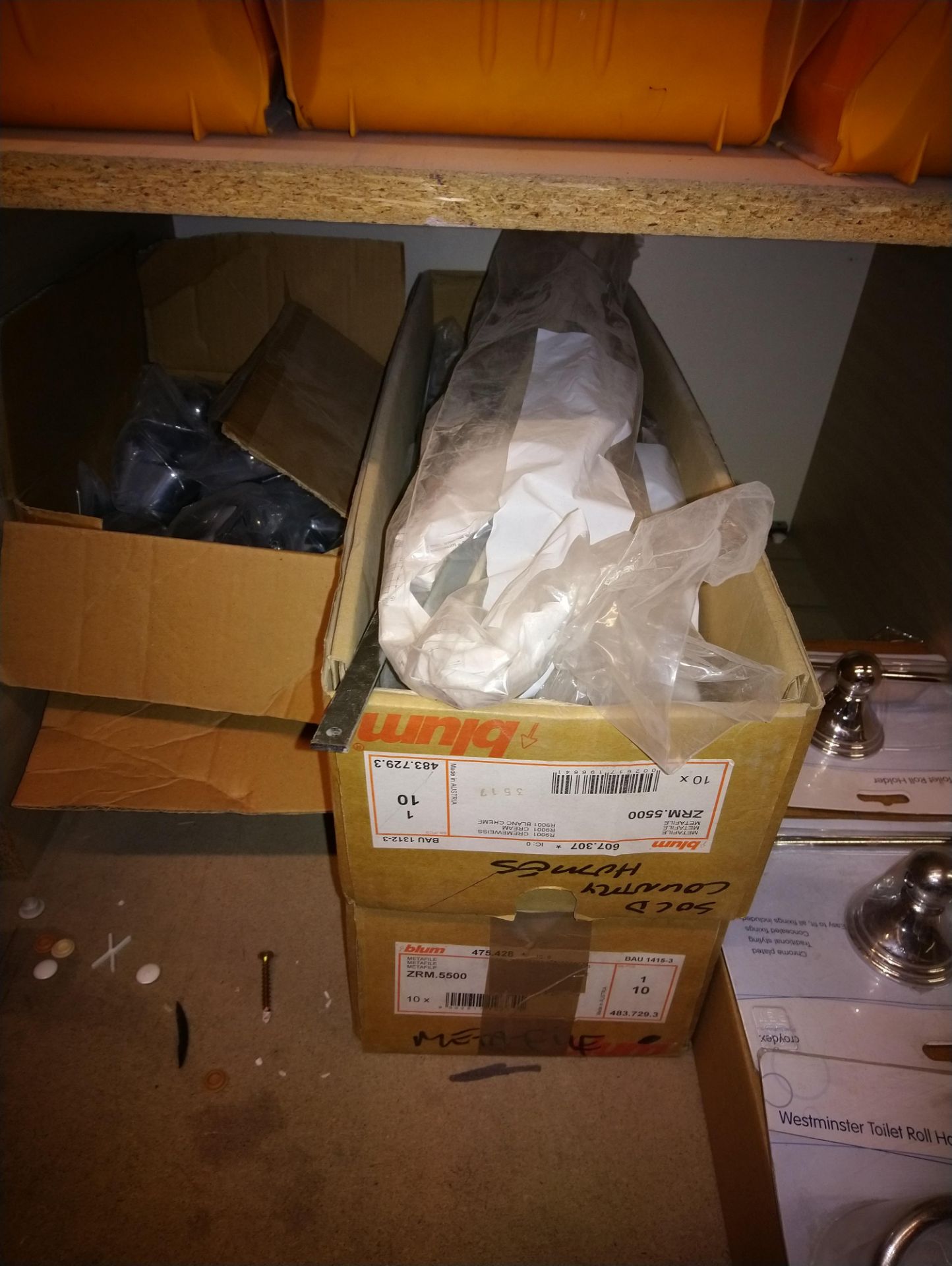 Four boxes of cupboard door components