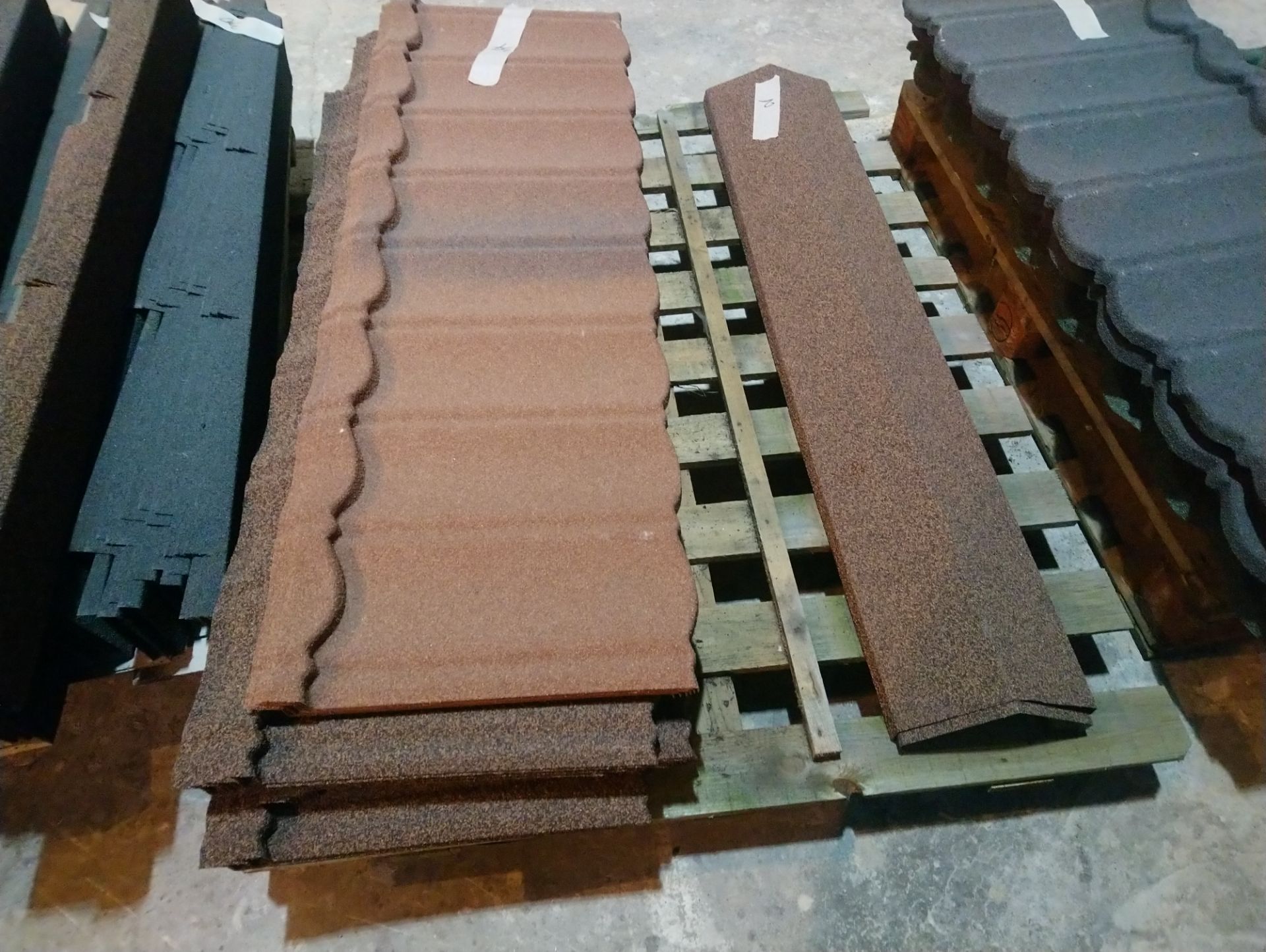 Pallet of approx 34 plastic textured roof tiles and 12 ridge tile lengths&nbsp;