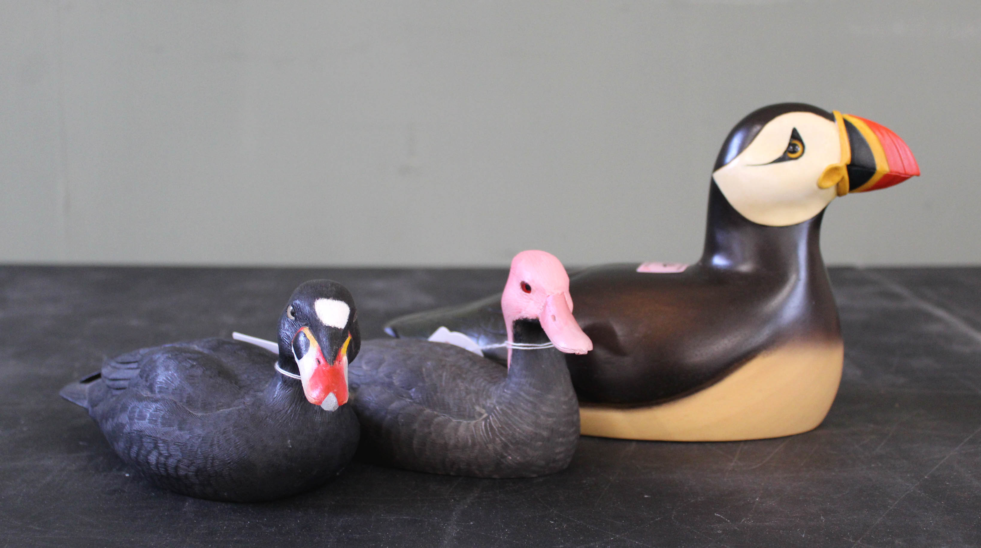 Two hand carved and painted Ducks (Pink Headed and Scoter) with a Puffin