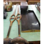 A pair of vintage carved wooden spring loaded crutches,