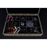 An oriental style multi compartment jewellery box and contents including silver and costume