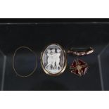 An 18ct gold shell cameo brooch and two yellow metal stone set brooches