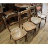 A set of four 19th Century beech and elm kitchen chairs