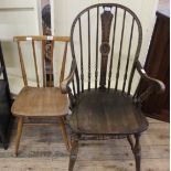 A 1920's stick back arm chair and a beech and elm kitchen chair