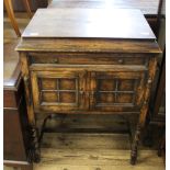 An oak cased Nelmur gramophone on barley twist legs