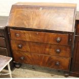 A Victorian inlaid mahogany bureau with three drawers