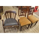 A 1940's oak smoker's bow chair and a pair of Edwardian oak dining chairs