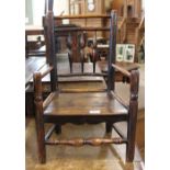 An 18th Century turned and spindle back child's elm armchair,