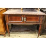 An Edwardian inlaid mahogany two door cupboard washstand with marble top