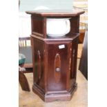 A reproduction mahogany pot cupboard with one tier shelf and pot