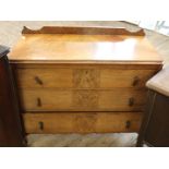 An Edwardian satinwood and burr walnut veneered chest of three drawers