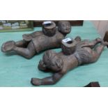 A pair of carved wooden Eastern figurines converted to candlesticks,