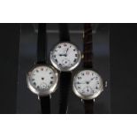 Three silver cased wristwatches