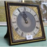 A late 19th Century brass and mahogany strut clock with key