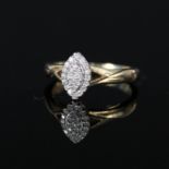 A 9ct gold diamond set ring in marquise shaped setting,
